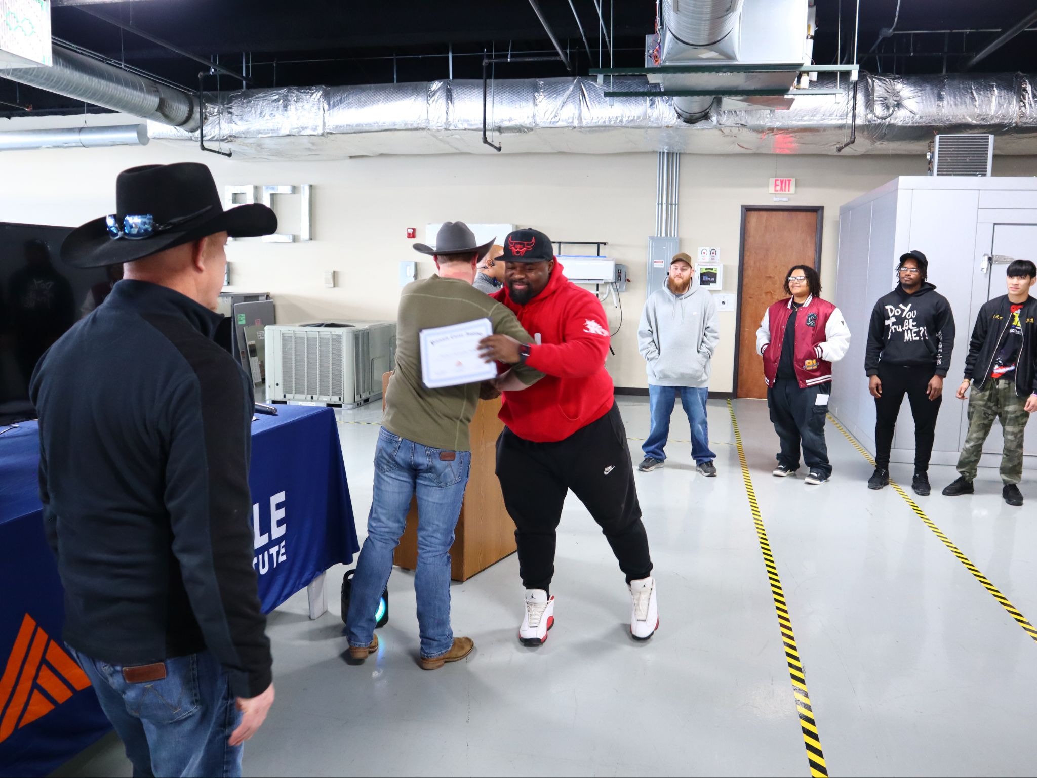 HVAC students at Pinnacle Career Institute celebrating their completion of boot camp