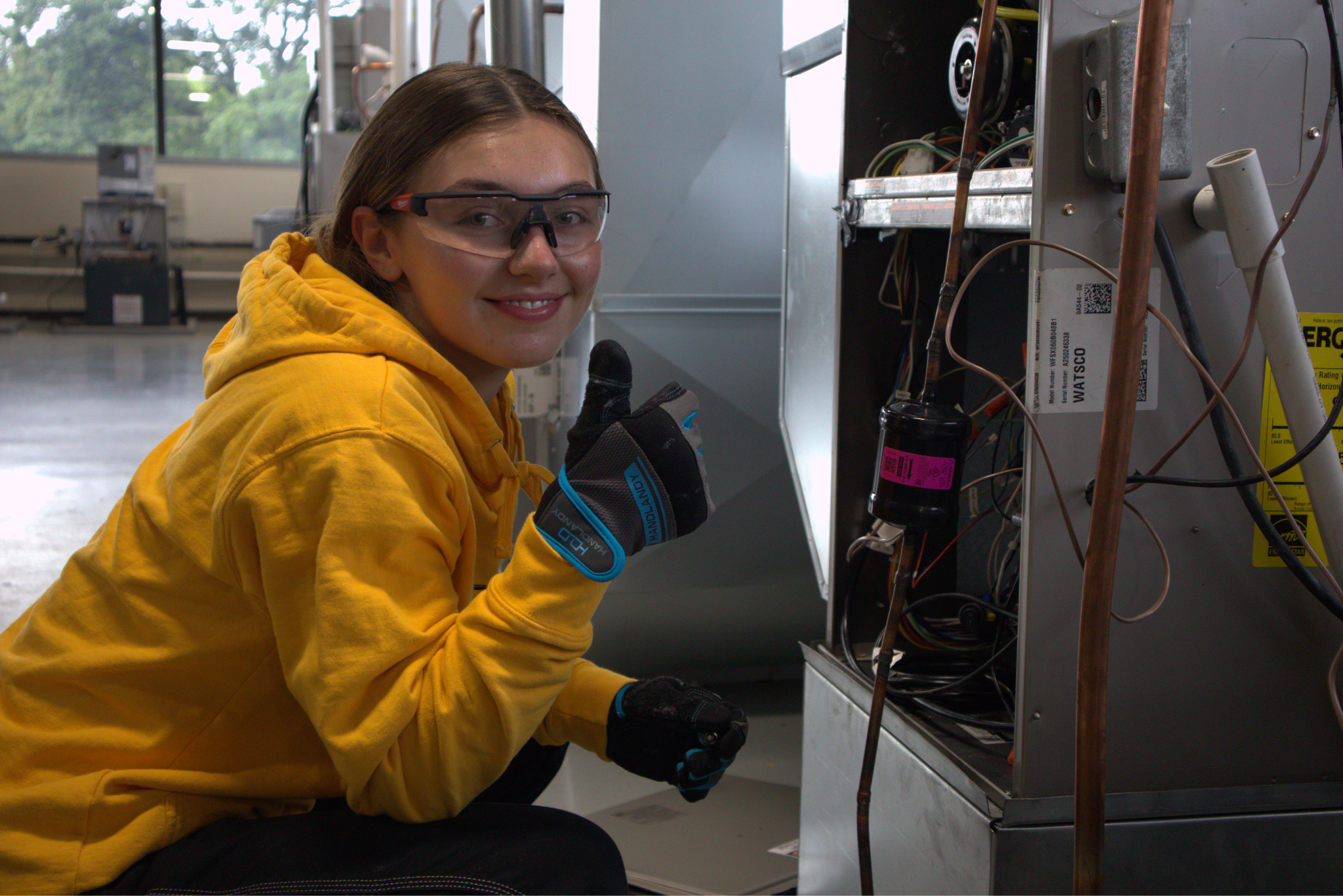 HVAC student at Pinnacle Career Institute giving the camera a thumbs up