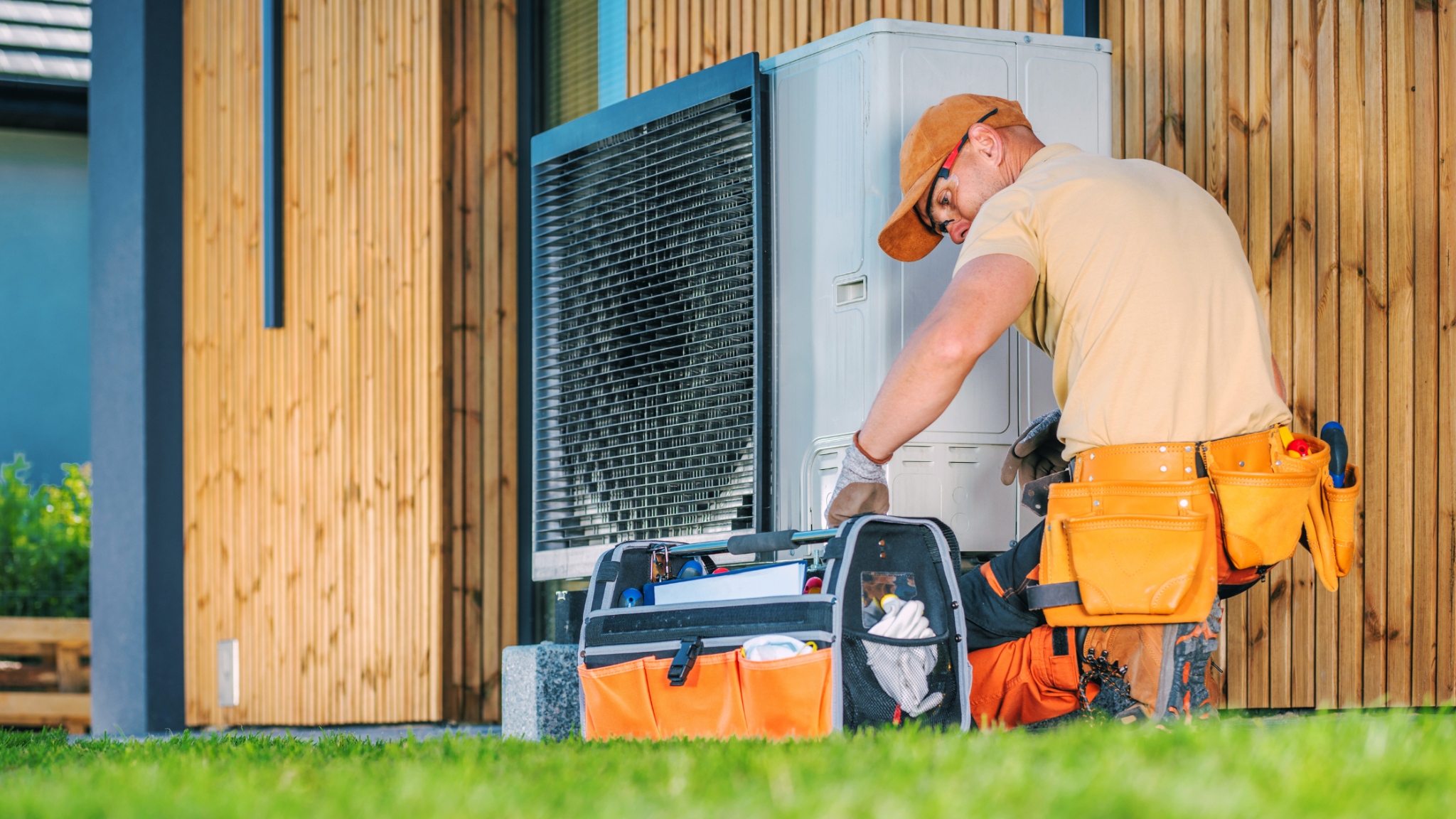 HVAC technician repairing a condenser unit