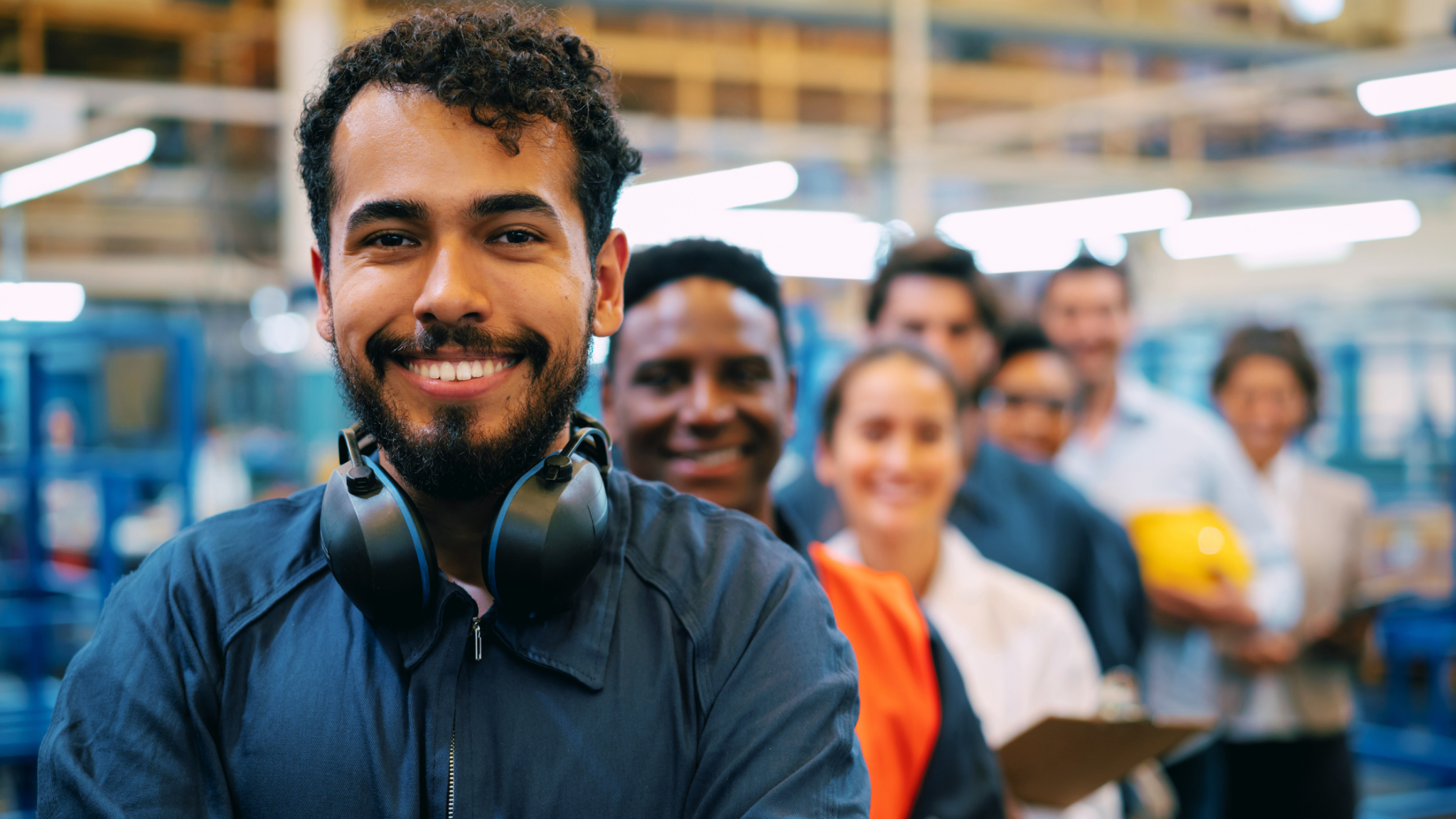 Technical training students standing together in a classroom or training facility.